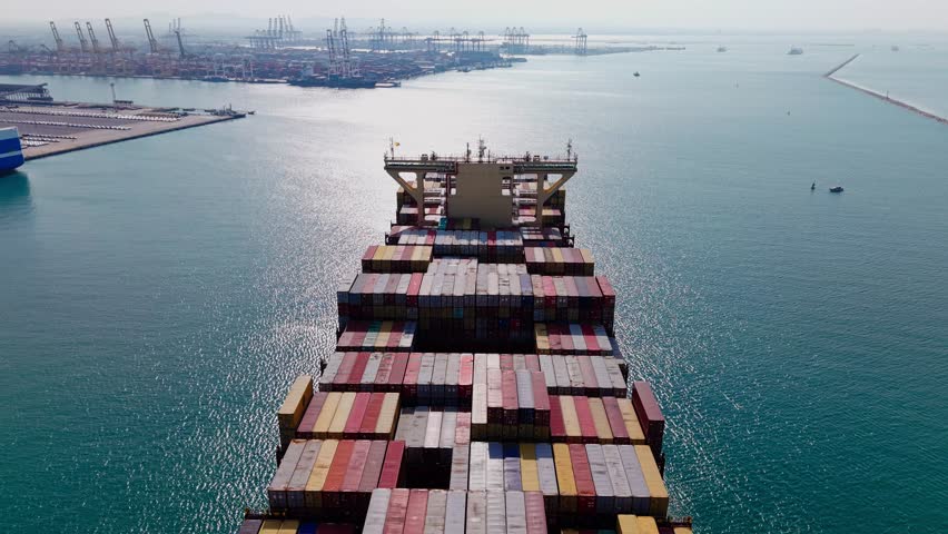 Cargo Ship Entering Busy Container Port