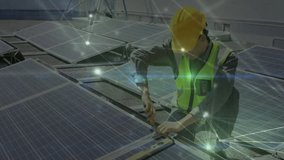 solar energy technician kneeling on roof connecting panel wiring, glowing network nodes overlaying. Renewable, power, technology, industry, engineering, outdoors, infrastructure - Powered by Shutterstock - Get 15% off with code: PIKWIZARD15