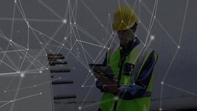 construction worker standing on site wearing yellow helmet, green vest, displaying network overlay. Industries, safety, automation, engineering, infrastructure, technology, industry - Powered by Shutterstock - Get 15% off with code: PIKWIZARD15