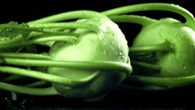 Kohlrabi falls on the table with a splash of water. Filmed on a high-speed camera at 1000 fps. High quality FullHD footage - Powered by Shutterstock - Get 15% off with code: PIKWIZARD15