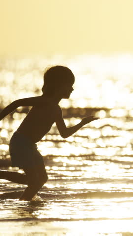 Active Child Running Freely At Seaside