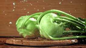 Drops of water fall on the kohlrabi cabbage. Filmed on a high-speed camera at 1000 fps. High quality FullHD footage - Powered by Shutterstock - Get 15% off with code: PIKWIZARD15