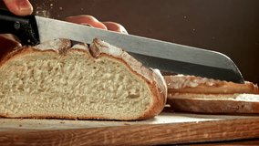 The chef slices fresh bread. Filmed on a high-speed camera at 1000 fps. High quality FullHD footage - Powered by Shutterstock - Get 15% off with code: PIKWIZARD15