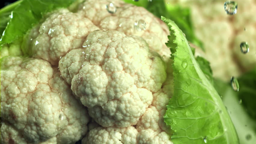 Raindrops fall on cauliflower. Filmed on a high-speed camera at 1000 fps. High quality FullHD footage