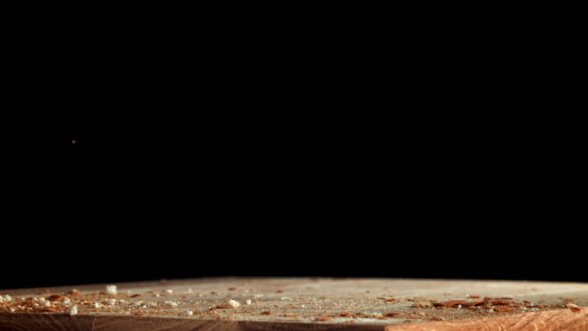 Sliced bread falls onto a cutting board. Filmed on a high-speed camera at 1000 fps. High quality FullHD footage