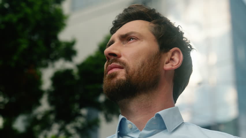 Close up Caucasian manager investor urban trader developer looking around look in sky lost in city navigation European man businessman guy male business thinking searching office company building