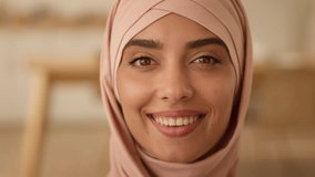 Happy toothy smiling with health white teeth carefree Arabian woman looking at camera at home office portrait Islamic lady Muslim Indian girl female in hijab smile face close up business businesswoman - Powered by Shutterstock - Get 15% off with code: PIKWIZARD15