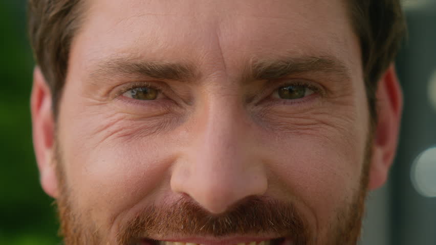 Extreme close up eyes wrinkled skin face of happy smiling pensive Caucasian middle-aged businessman adult business man male guy in city look away looking at camera health vision cataract medicine
