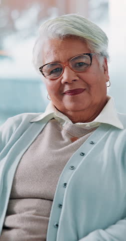 Face, home and old woman with smile, funny and humor with happiness, relaxing and retirement. Portrait, pensioner and senior person with weekend break, glasses and pride with laughing or elderly care