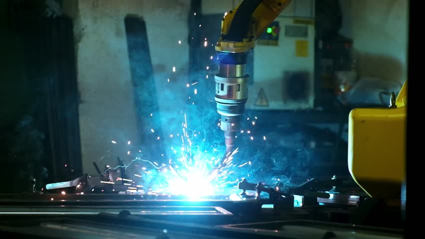 Robotic Arm Welding Metal in Factory
