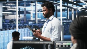 Data center technician uses node tree programming interface to identify equipment performance issues. Engineer reviews data analysis graph in server hub to minimize hardware failures, camera B - Powered by Shutterstock - Get 15% off with code: PIKWIZARD15