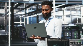 Data center programmer uses node tree software to identify equipment performance issues. African american server farm worker reviews data analysis graph to minimize hardware failures, camera B - Powered by Shutterstock - Get 15% off with code: PIKWIZARD15