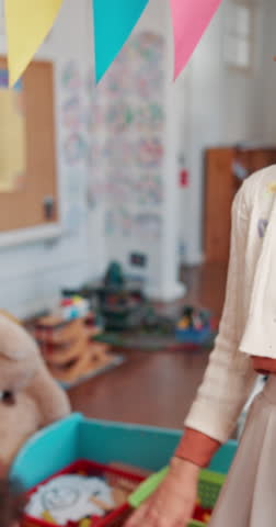 Children, hands or teacher with high five for teamwork, unity or childhood development at school. Closeup, group or kids with educator for education, fun learning or community in youth or classroom