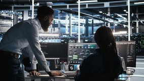 Data center manager supervising engineer using node tree tool to identify equipment performance issues. Server hub team leader talks with IT specialist reviewing data analysis graph, camera A - Powered by Shutterstock - Get 15% off with code: PIKWIZARD15