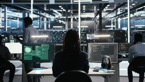 Cybersecurity team in data center responds to security breach, trying to prevent unauthorized access. Workers rushing to secure servers and protect sensitive information during cyberattack, camera A - Powered by Shutterstock - Get 15% off with code: PIKWIZARD15