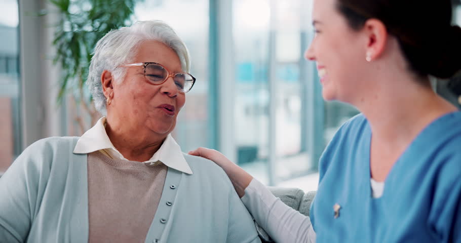 Discussion, healthcare and nurse with senior woman on sofa in nursing home for consultation. Happy, good news and caregiver with elderly female patient for medical checkup in living room at house.