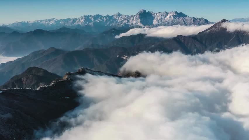 Aerial View of Majestic Mountain Range with Clouds