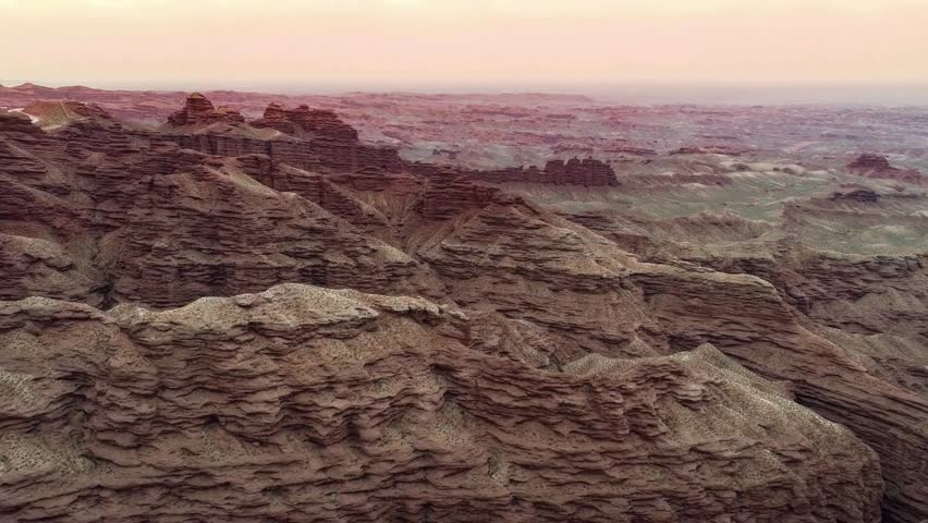 Panoramic View of Desert Rock Formations at Sunset