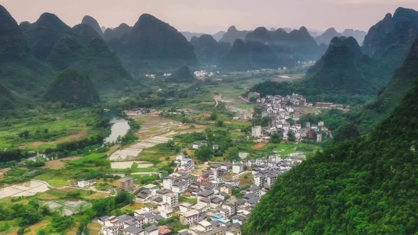 Panoramic View of Karst Mountains and Rural Village in China