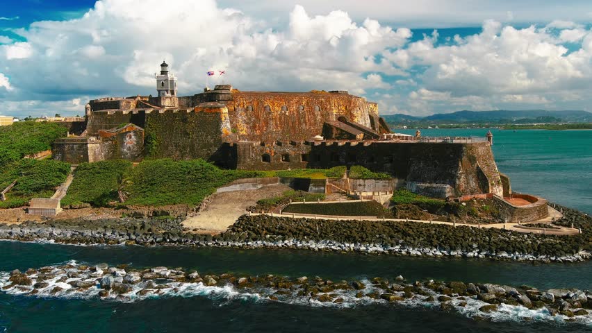 4K steady drone shot of San Felipe del Morro Castle, San Juan, Puerto Rico. Captures historic fort and ocean views. For tourism, history, culture. No people or trademarks.