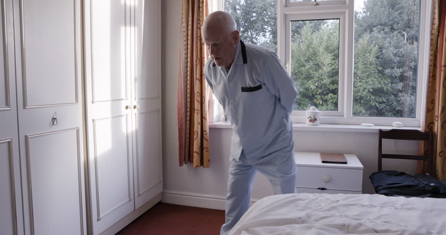 Elderly man, hip rotatation exercise and morning stretching for senior healthcare, mobility training and flexibility workout. Retirement home, health rehabilitation center and old man with back pain
