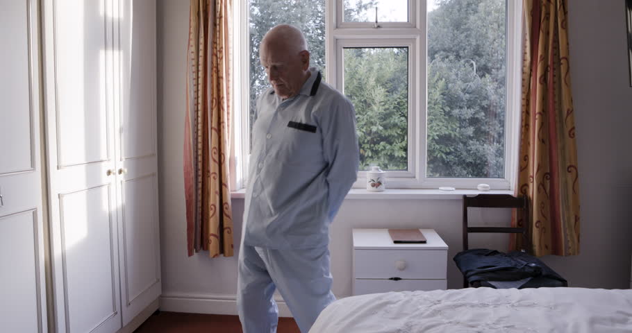 Elderly man, hip rotatation exercise and morning stretching for senior healthcare, mobility training and flexibility workout. Retirement home, health rehabilitation center and old man with back pain