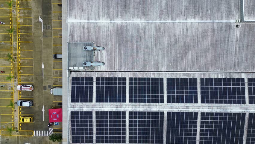 Drone Aerial View of Industrial Building with Solar Panels, Sustainable Energy Concept. High quality 4k footage - Powered by Shutterstock - Get 15% off with code: PIKWIZARD15