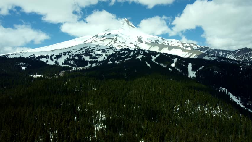 US, Oregon, Mt Hood, Bennett Pass, 2025-04-22 - Drone view of Mt Hood outside of Portland. On a spring day, with some clouds, viewed from the Southeast at Mt Hood Meadows
