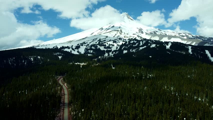 US, Oregon, Mt Hood, Bennett Pass, 2025-04-22 - Drone view of Mt Hood outside of Portland. On a spring day, with some clouds, viewed from the Southeast at Mt Hood Meadows