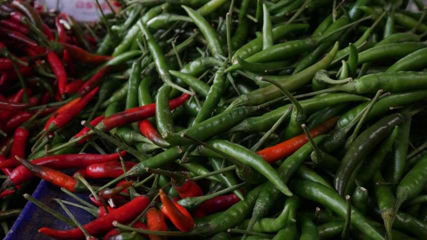 Fresh Organic red hot chilli peppers and green chilli peppers at local market.