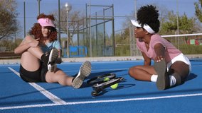 Women athletes warming up on tennis court, performing synchronized stretching exercises together, building partnership and fitness through shared athletic preparation - Powered by Shutterstock - Get 15% off with code: PIKWIZARD15