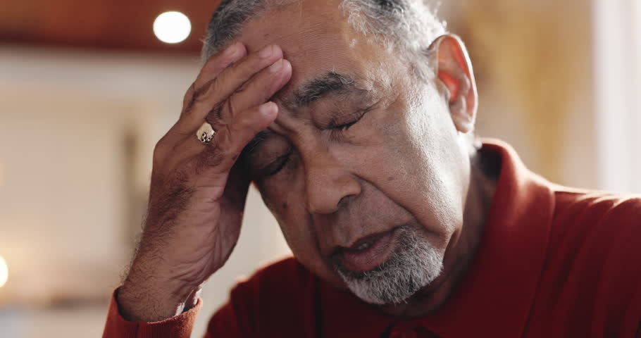 Senior, man and pain of headache in home with brain fog, massage tension and hypertension. Retirement, sad elderly person and migraine of vertigo, pressure and mental health with stress and illness