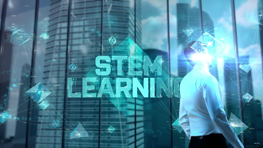 STEM learning. Businessman Working in Office among Skyscrapers. Hologram Concept - Powered by Shutterstock - Get 15% off with code: PIKWIZARD15
