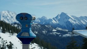 Young Woman Using a Binocular Viewer To Look At Jagged And Snowy Mountains In The Bavarian Alps Near Berchtesgaden, Germany - Powered by Shutterstock - Get 15% off with code: PIKWIZARD15