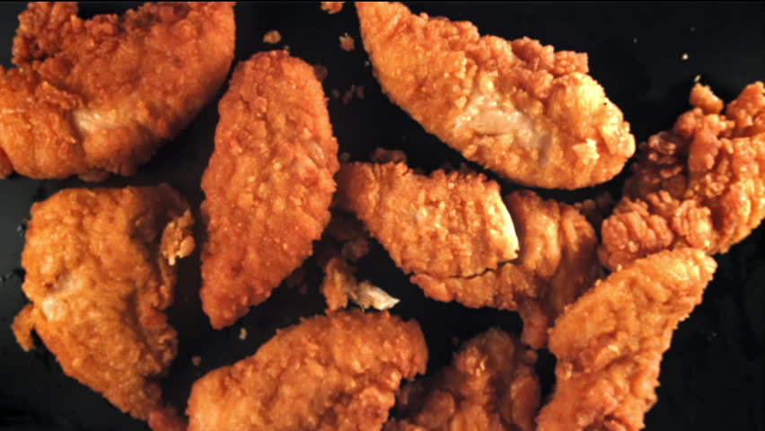 Chicken nuggets fly up and fall down. Filmed on a high-speed camera at 1000 fps. High quality FullHD footage