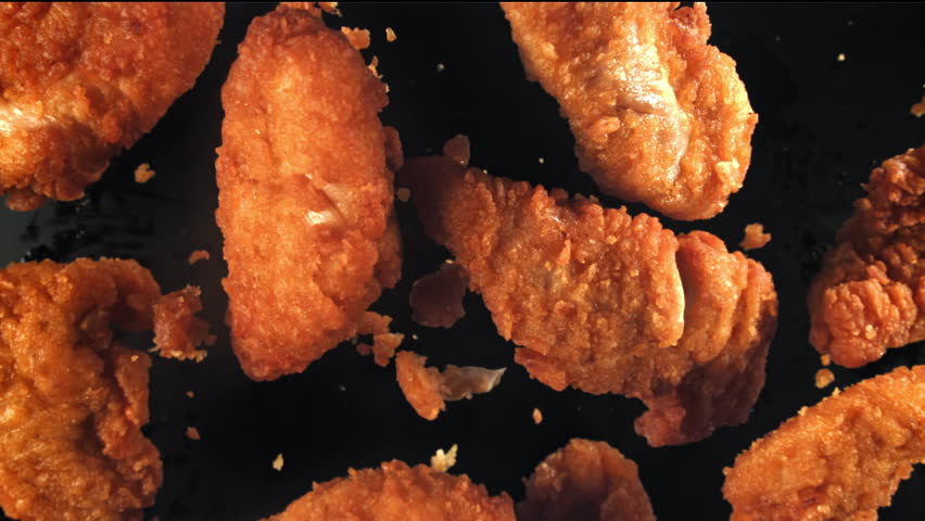 Chicken nuggets fly up and fall down. Filmed on a high-speed camera at 1000 fps. High quality FullHD footage