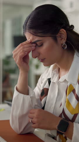 Business woman, headache and stress in office with burnout, audit migraine or fatigue. Accountant, employee overwhelmed and brain fog at desk with exhaustion, deadline pressure and eye strain