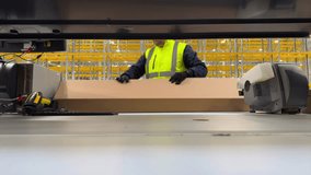 Warehouse worker packing products into boxes. Order fulfillment process in logistics or e-commerce. Fast, organized packing at an industrial workplace - Powered by Shutterstock - Get 15% off with code: PIKWIZARD15
