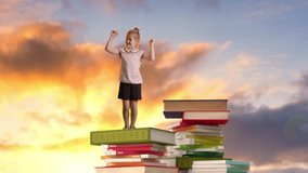Schoolgirl standing on stack of colored books against sunset city background. Pupil raising hands up in triumph. Concept of education, reading and adventure. - Powered by Shutterstock - Get 15% off with code: PIKWIZARD15