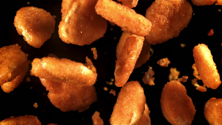 Chicken nuggets fly up and fall down. Filmed on a high-speed camera at 1000 fps. High quality FullHD footage