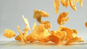 Corn flakes falling on white background. Filmed on a high-speed camera at 1000 fps. High quality FullHD footage - Powered by Shutterstock - Get 15% off with code: PIKWIZARD15