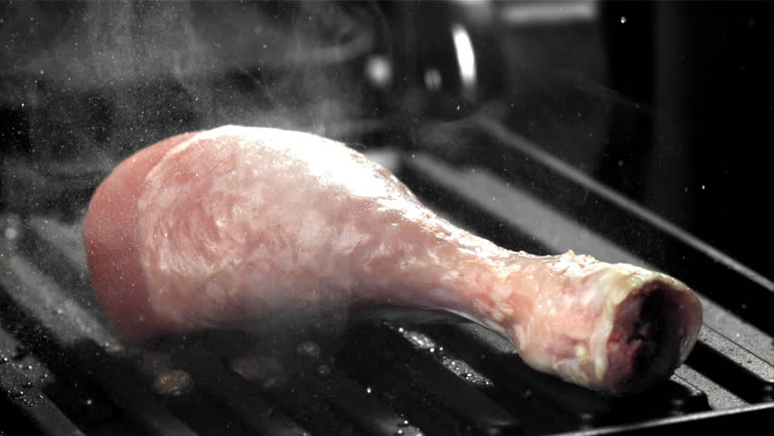 Chicken legs are fried in a pan. Filmed on a high-speed camera at 1000 fps. High quality FullHD footage