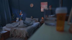 Rack focus shot of senior man taking sleeping pills and drinking water from glass, then going to bed in dark room at night - Powered by Shutterstock - Get 15% off with code: PIKWIZARD15