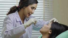 Facial aesthetics surgery treatment : Plastic (Cosmetic) Surgery Center :  Brazilian hispanic female Doctor preparing Asian female patient for cosmetic surgery in clinic - Powered by Shutterstock - Get 15% off with code: PIKWIZARD15
