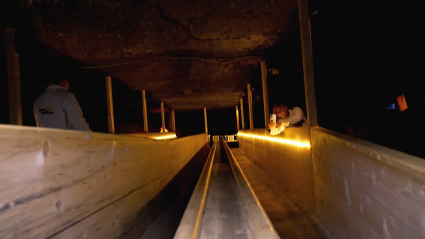  Salt Mine in  Hallstatt, Austria.Sliding in the former salt mine facility at the Hallstatt Salt Mine, Hallstatt, Austria.  Longest Miner’s Slide in the World at Salzwelten Hallstatt. Travel concept.