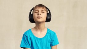 Teenager boy listens music outdoor at the backyard - Powered by Shutterstock - Get 15% off with code: PIKWIZARD15