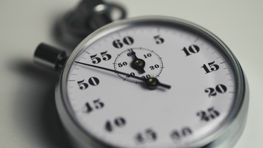 Close-up of a classic analog stopwatch counting seconds in real time. Precision timing concept symbolizing speed, accuracy, deadlines, time management in sports, business, or productivity contexts. 