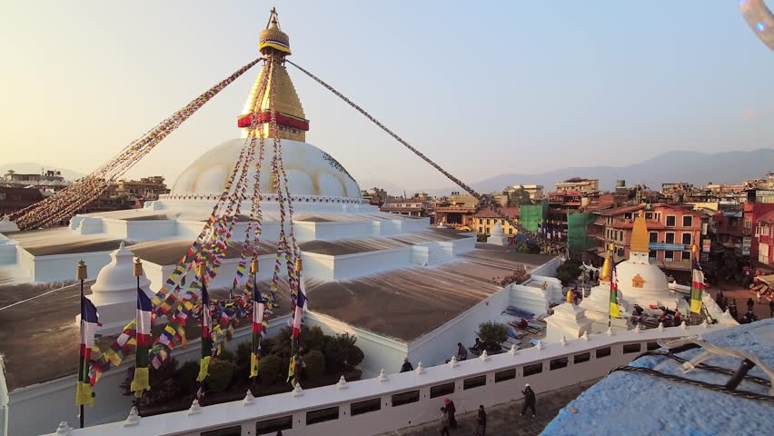 Kathmandu, Nepal - 15th november, 2023: time lapse of Bouddha or Boudhanath on sunset and visitors sightseeing city. Khasti Chaitya and Khāsa Chaitya stupa in Kathmandu, Nepa