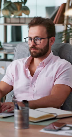 Businessman, injury or back pain with discomfort on computer for muscle tension or inflammation at office. Man, employee or spine ache with technology for bad posture, pressure or strain at workplace