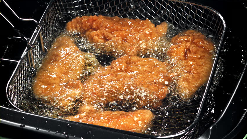 Chicken nuggets are fried in oil. Filmed on a high-speed camera at 1000 fps. High quality FullHD footage